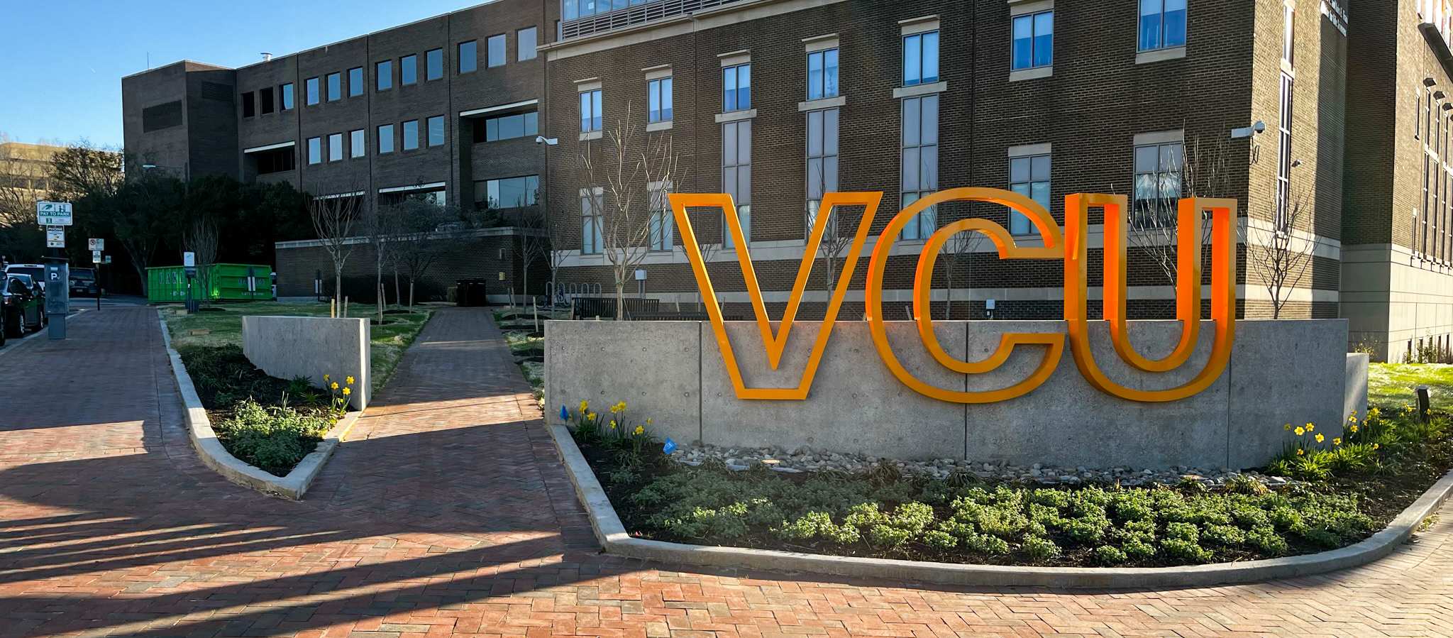 VCU sign in front of building with sidewalk