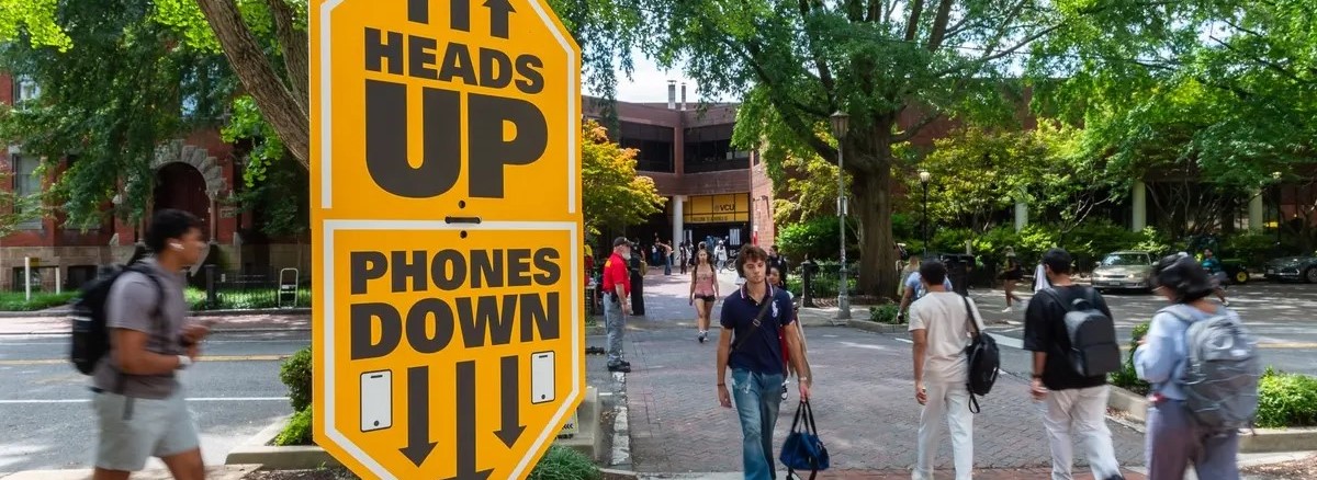 Sign on pole at a crosswalk